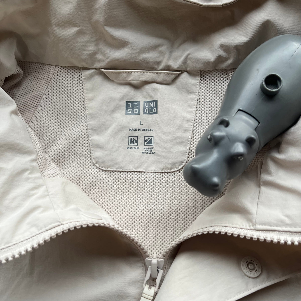 Upcycled Large Unisex Uniqlo Rainjacket - Women with Revolver